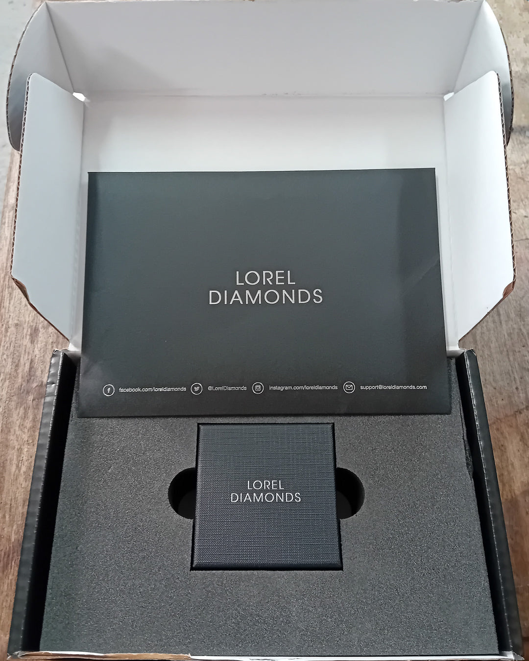 Never-Worn Platinum Zambian Emerald & Diamond Engagement Ring