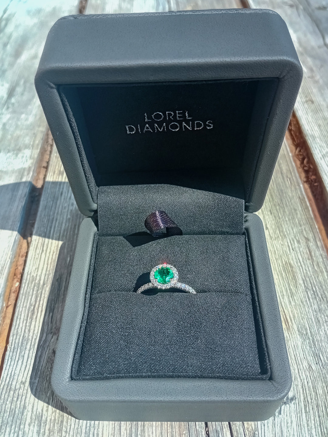 Never-Worn Platinum Zambian Emerald & Diamond Engagement Ring