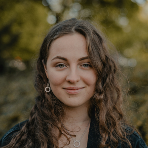 girl wearing howlite and silver earring and pendant set