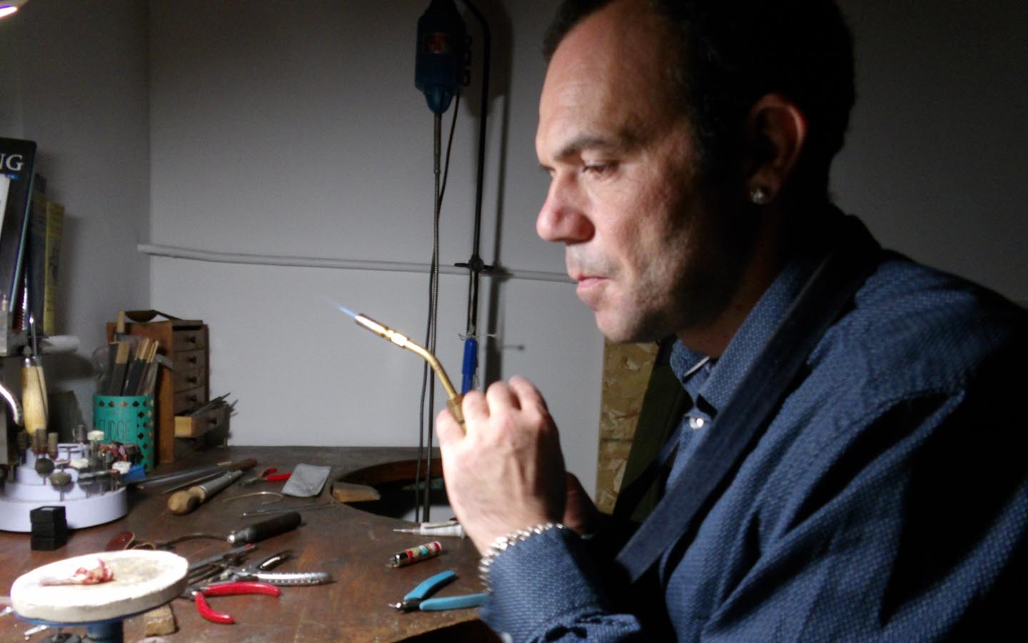 Robert Ketch working at the Ketch Fine Jewellery workshop in Tunbridge Wells repairing a gold ring